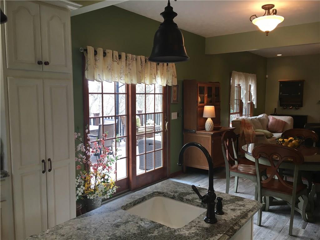 643 Neville Road Beaver, PA 15009 - Photo 3 of 25 Looking into the great room from the kitchen...and out the doors to the deck!
