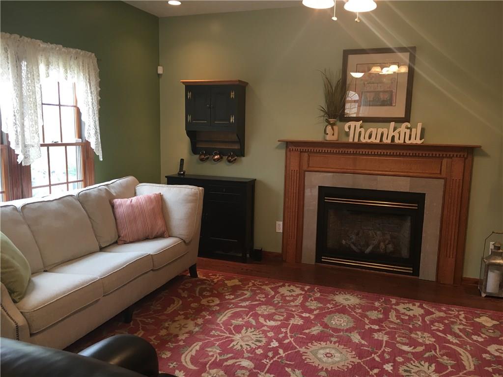 643 Neville Road Beaver, PA 15009 - Photo 6 of 25 A gas fireplace in the family/great room. That is a red maple mantle...and those are hardwood floors.