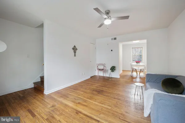 a view of livingroom and dining room with wooden floor