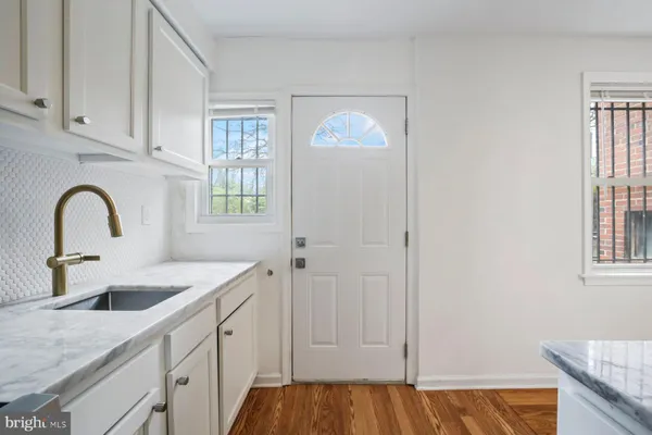 a kitchen with a sink and cabinets