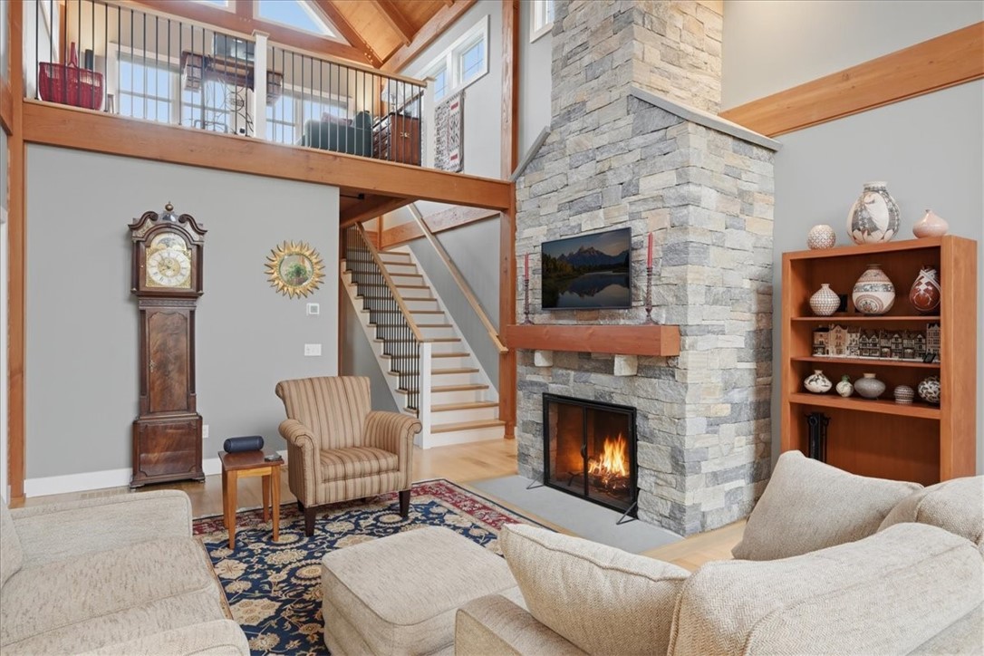 18 Fallon Trail Westerly, RI 02891 - Photo 9 of 31 A floor to ceiling stone wood burning fireplace and adds so much character to this spacious and well laid out design.