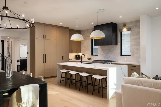 a large kitchen with a table and chairs
