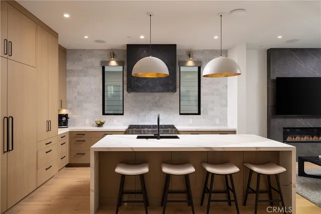 a kitchen with granite countertop a sink and a stove