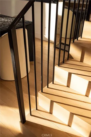 a view of staircase with white walls and a window