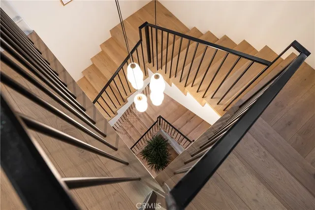 a bedroom with a large bed and a large window