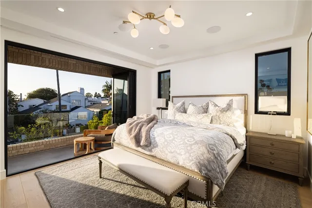 a bedroom with a bed and glass door