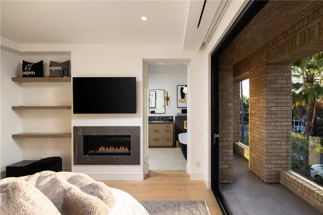 a bathroom with a granite countertop sink vanity mirror shower and