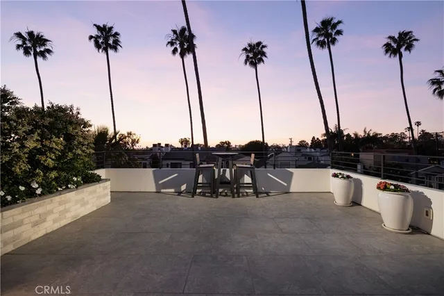 a view of a patio with couches chairs and a fire pit