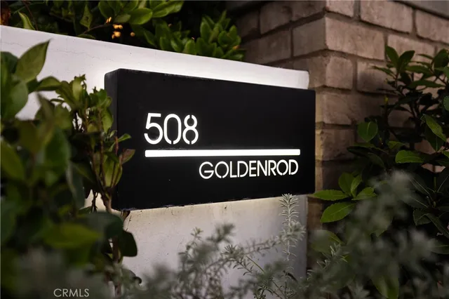 a view of a patio with table and chairs and potted plants