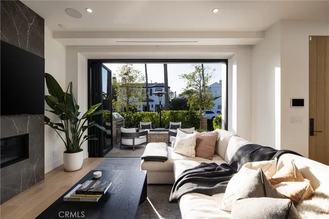 a living room with furniture fireplace and a flat screen tv