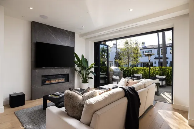 a living room with fireplace furniture and a flat screen tv