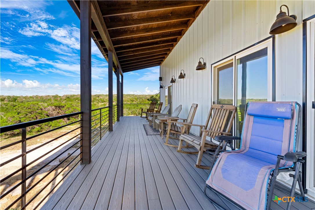 582 Delaware Creek Road Boerne, TX 78006 - Photo 11 of 48 a view of deck with furniture and wooden floor