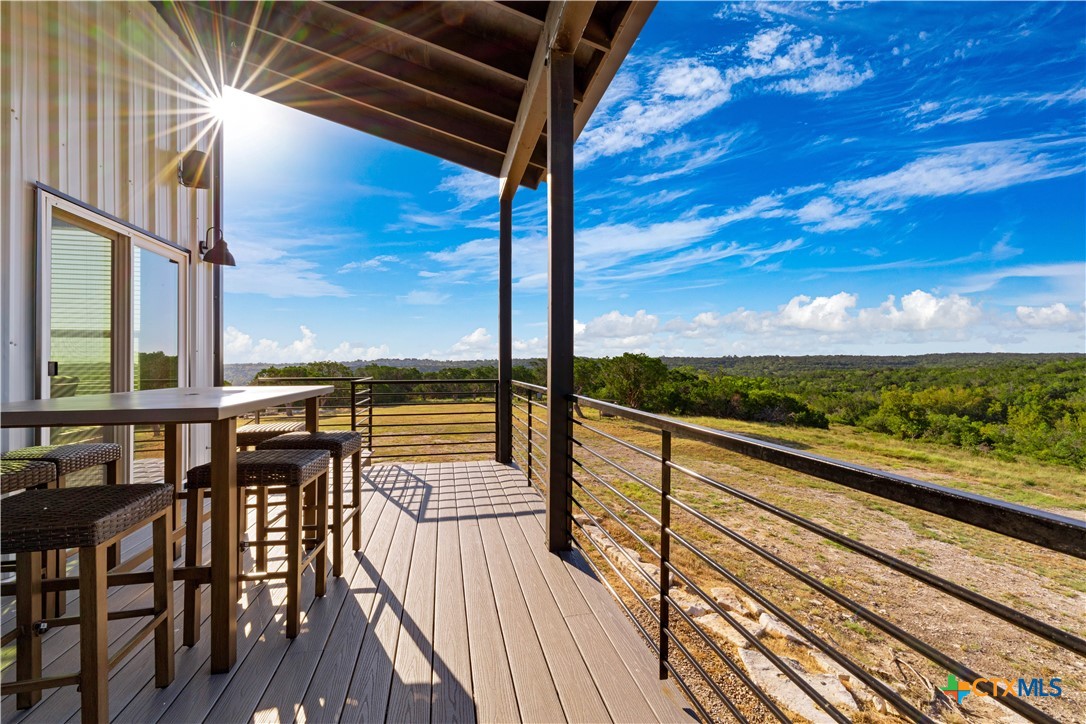 582 Delaware Creek Road Boerne, TX 78006 - Photo 12 of 48 a view of balcony with chairs