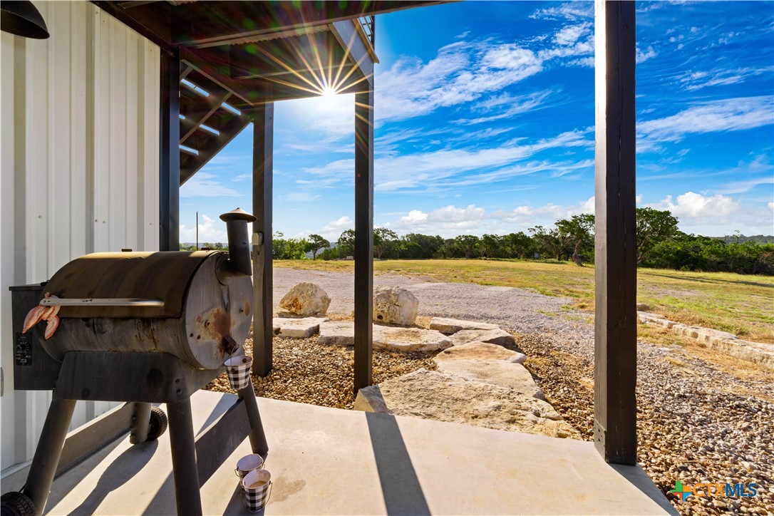 582 Delaware Creek Road Boerne, TX 78006 - Photo 15 of 48 a view of living room with furniture and floor to ceiling windows