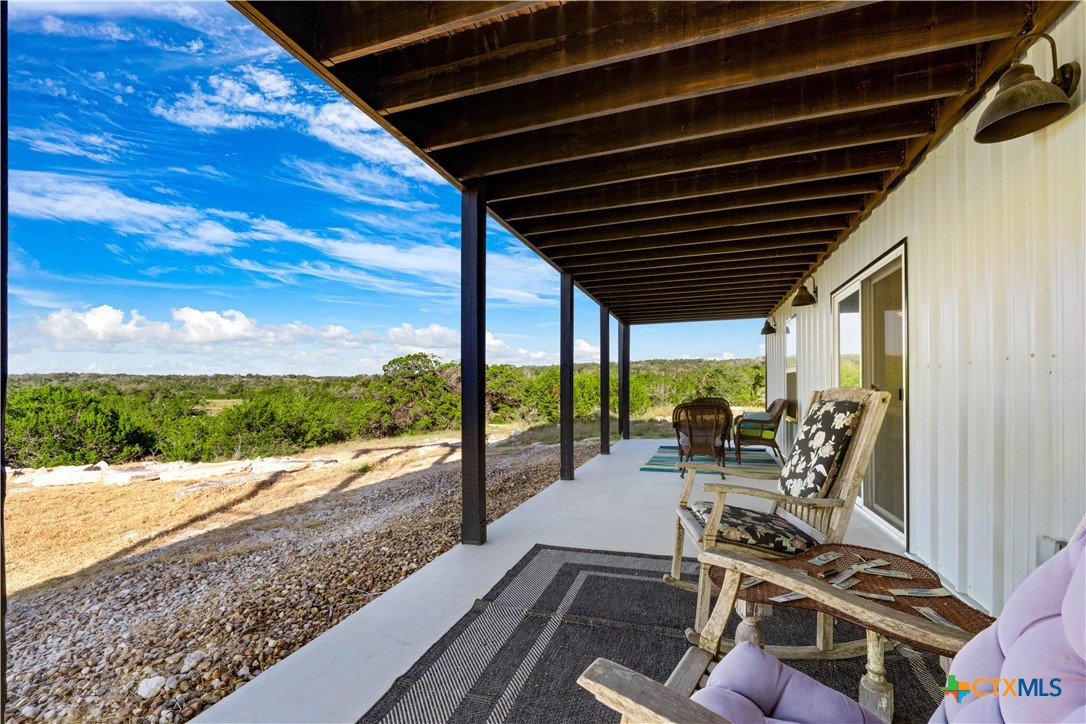 582 Delaware Creek Road Boerne, TX 78006 - Photo 16 of 48 a building outdoor space with patio furniture