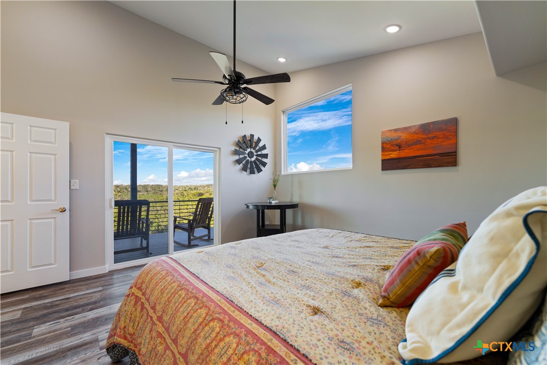 582 Delaware Creek Road Boerne, TX 78006 - Photo 23 of 48 a bed sitting in a bedroom next to a window