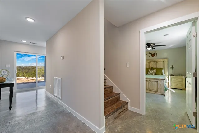 a bedroom with a bed and a table