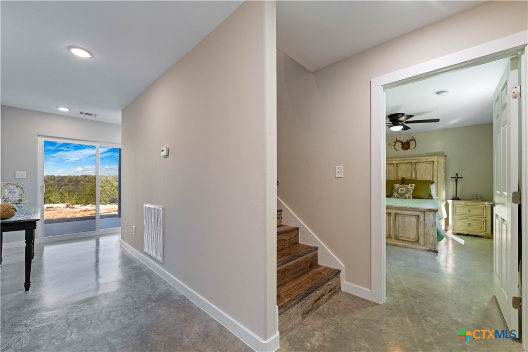 582 Delaware Creek Road Boerne, TX 78006 - Photo 25 of 48 a view of a hallway view with living room