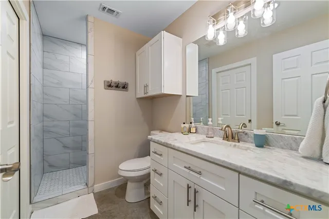 a bedroom with bed and a closet