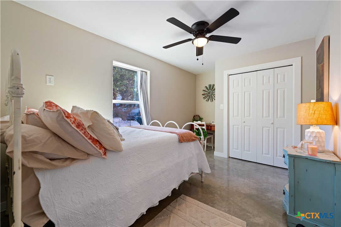 582 Delaware Creek Road Boerne, TX 78006 - Photo 30 of 48 a bedroom with bed and a closet