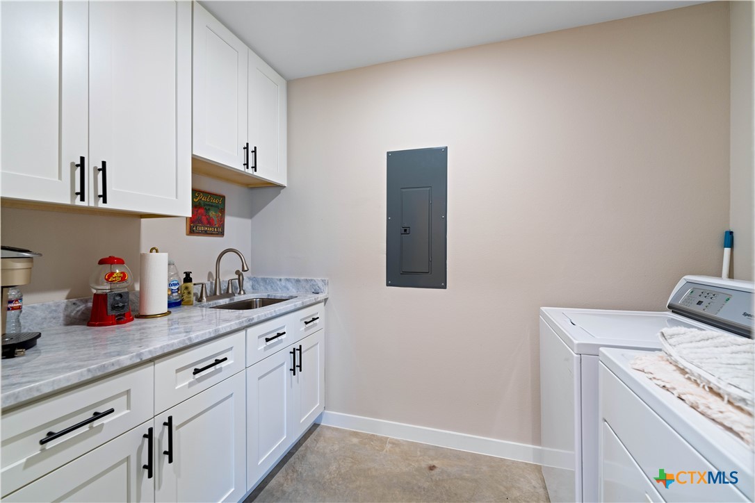 582 Delaware Creek Road Boerne, TX 78006 - Photo 31 of 48 a kitchen with a sink and cabinets