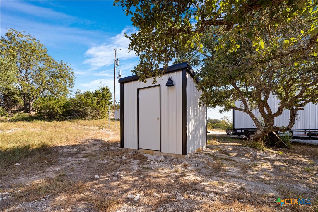 582 Delaware Creek Road Boerne, TX 78006 - Photo 33 of 48 a view of a house with a snow in the yard