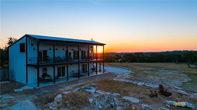 a view of house with outdoor space