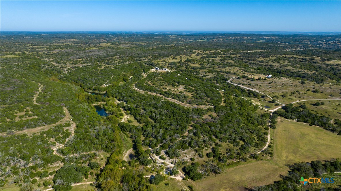 582 Delaware Creek Road Boerne, TX 78006 - Photo 45 of 48 an aerial view of residential houses with outdoor space and trees