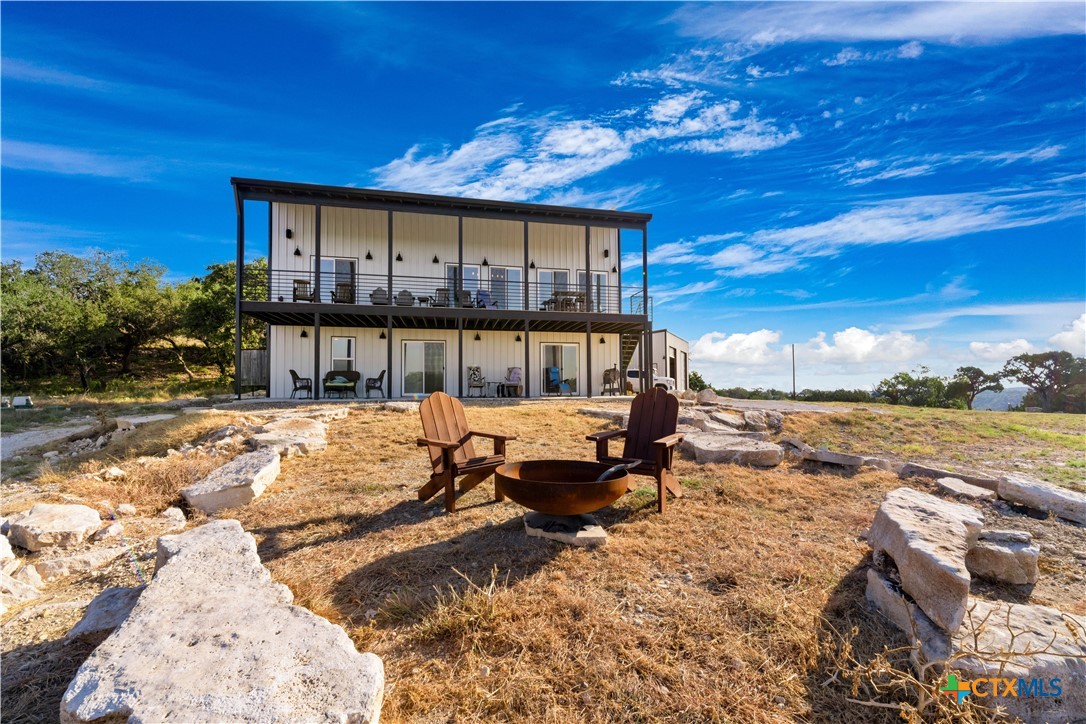 582 Delaware Creek Road Boerne, TX 78006 - Photo 5 of 48 a view of a house with a swimming pool