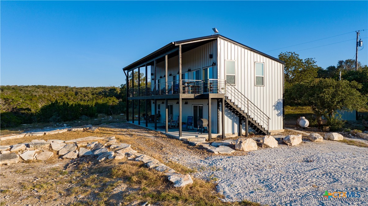 582 Delaware Creek Road Boerne, TX 78006 - Photo 6 of 48 a front view of a house with a yard