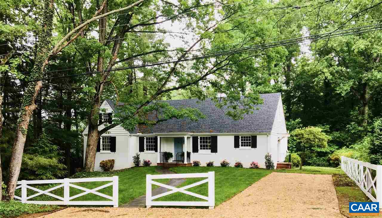 1893 Westview Road Charlottesville, VA 22903 - Photo 1 of 35 a front view of a house with a yard table and chairs