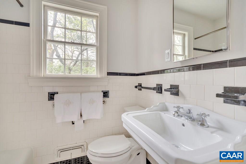 1893 Westview Road Charlottesville, VA 22903 - Photo 21 of 35 a bathroom with a sink a toilet and a bathtub