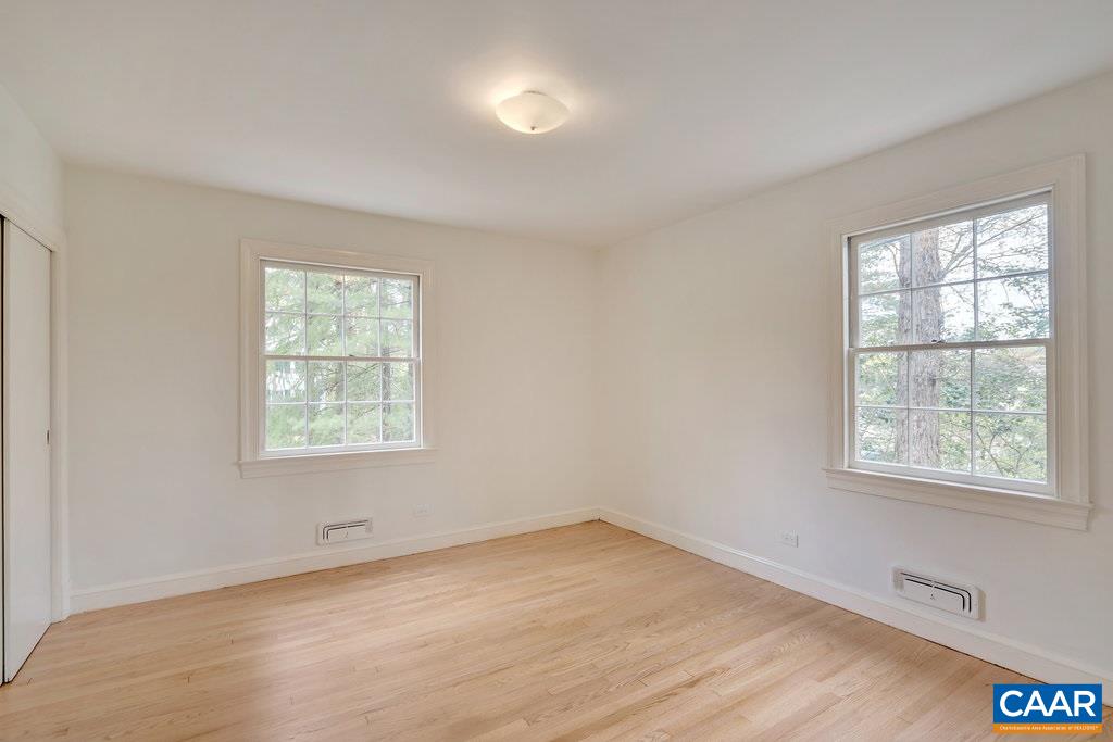 1893 Westview Road Charlottesville, VA 22903 - Photo 22 of 35 an empty room with wooden floor and windows