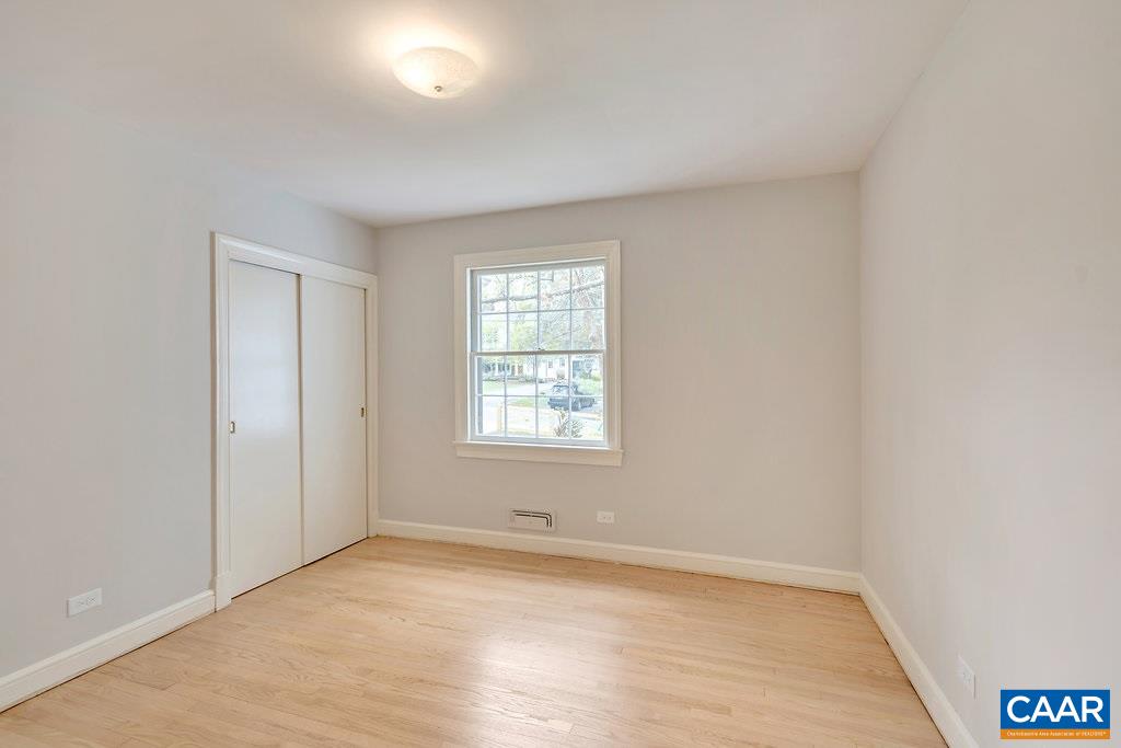 1893 Westview Road Charlottesville, VA 22903 - Photo 23 of 35 an empty room with wooden floor and windows