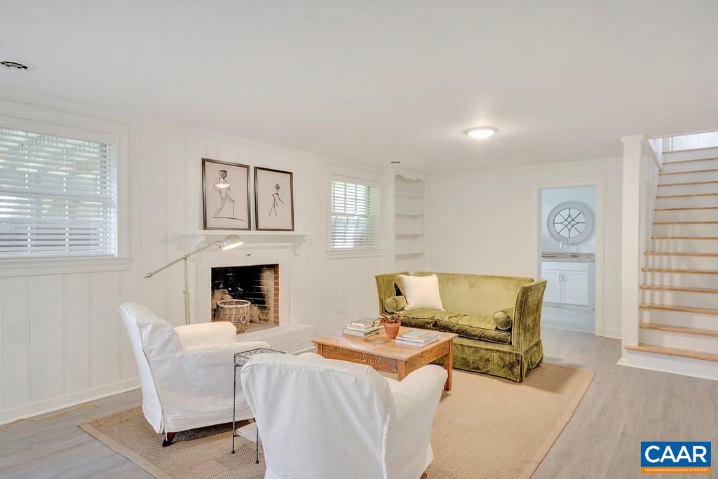 1893 Westview Road Charlottesville, VA 22903 - Photo 25 of 35 a living room with furniture a fireplace and a window