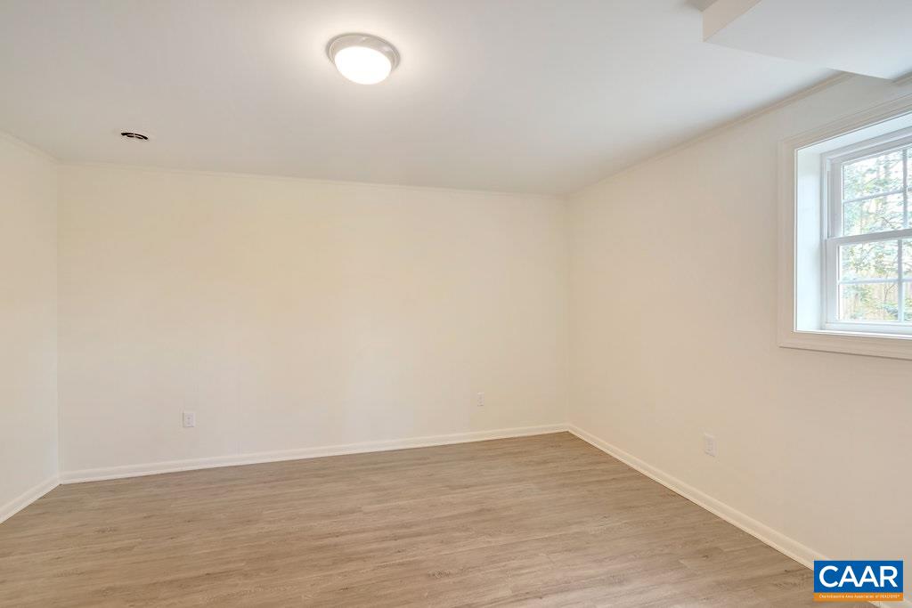 1893 Westview Road Charlottesville, VA 22903 - Photo 28 of 35 a view of an empty room with wooden floor and a window