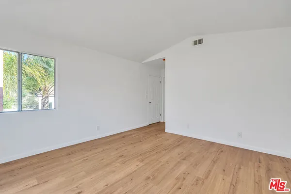 a bathroom with double vanity sinks and a mirror