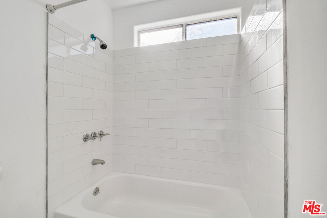 25845 Browning Place Stevenson Ranch, CA 91381 - Photo 25 of 36 a close up of a bathtub curtain
