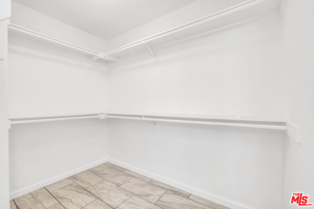25845 Browning Place Stevenson Ranch, CA 91381 - Photo 26 of 36 a view of an empty walk in closet