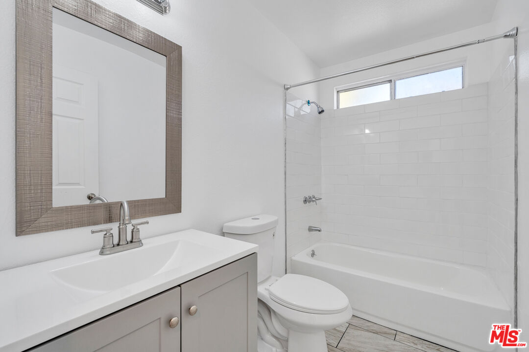 25845 Browning Place Stevenson Ranch, CA 91381 - Photo 27 of 36 a bathroom with a sink toilet and shower