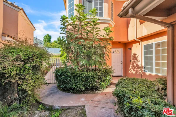 a view of a backyard with plants