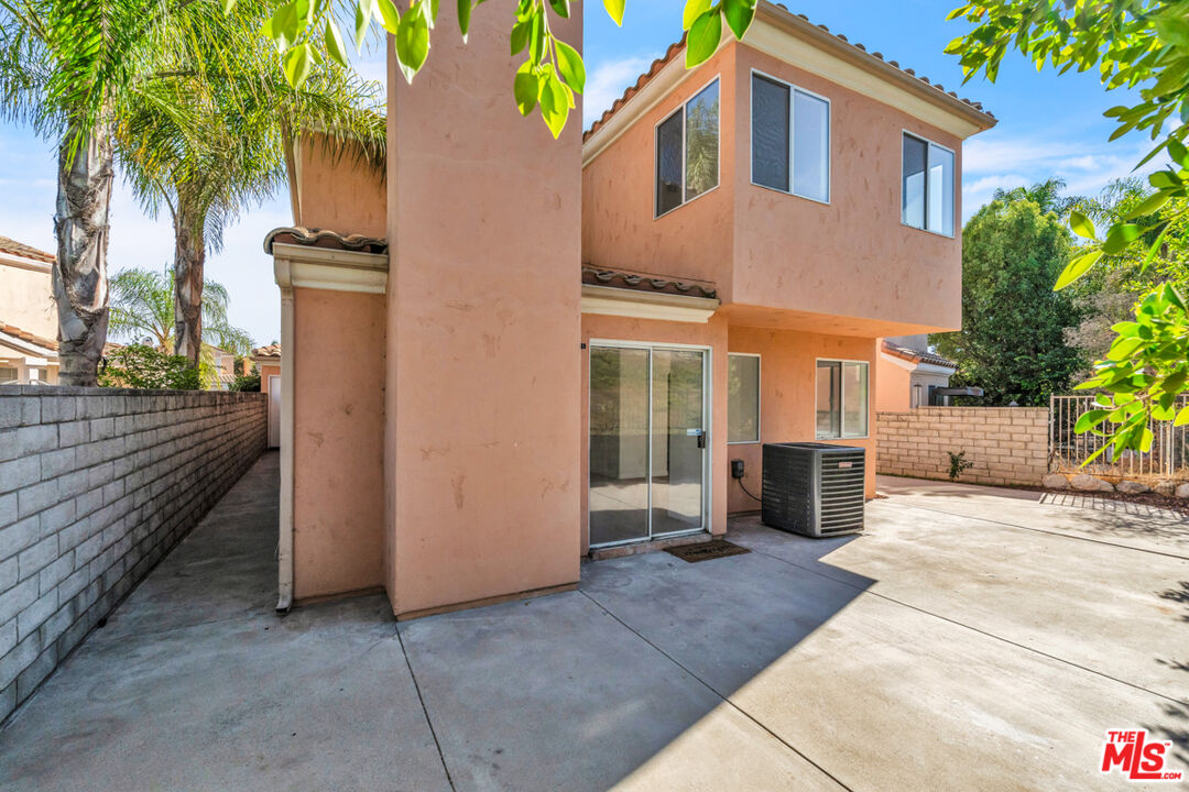 25845 Browning Place Stevenson Ranch, CA 91381 - Photo 33 of 36 a front view of a house with a yard