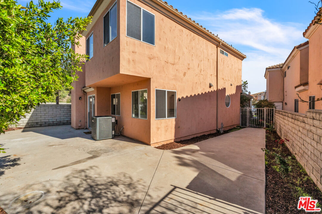 25845 Browning Place Stevenson Ranch, CA 91381 - Photo 35 of 36 a view of a street with a building in the background