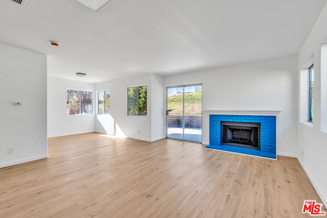 25845 Browning Place Stevenson Ranch, CA 91381 - Photo 6 of 36 wooden floor fireplace and windows in an empty room