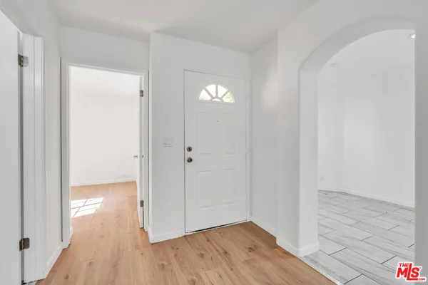 a view of entryway with wooden floor
