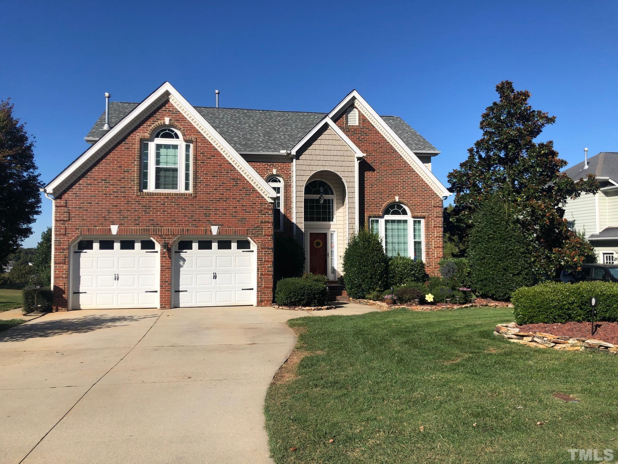 468 Seastone Street Raleigh, NC 27603 - Photo 2 of 28 a front view of a house with a yard