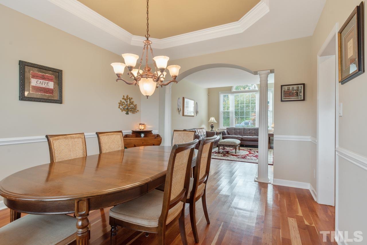 468 Seastone Street Raleigh, NC 27603 - Photo 12 of 28 a view of a dining room with furniture and wooden floor