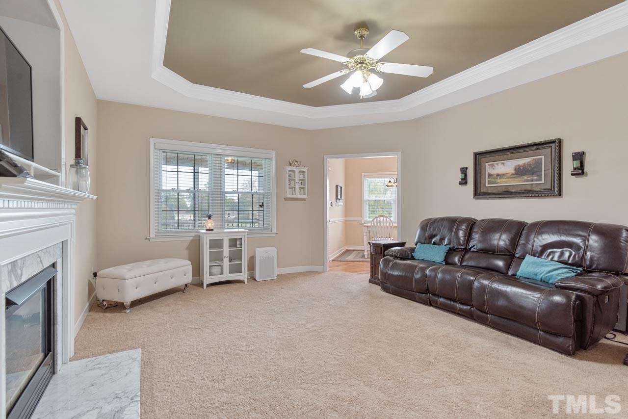 468 Seastone Street Raleigh, NC 27603 - Photo 18 of 28 a living room with furniture and a fireplace