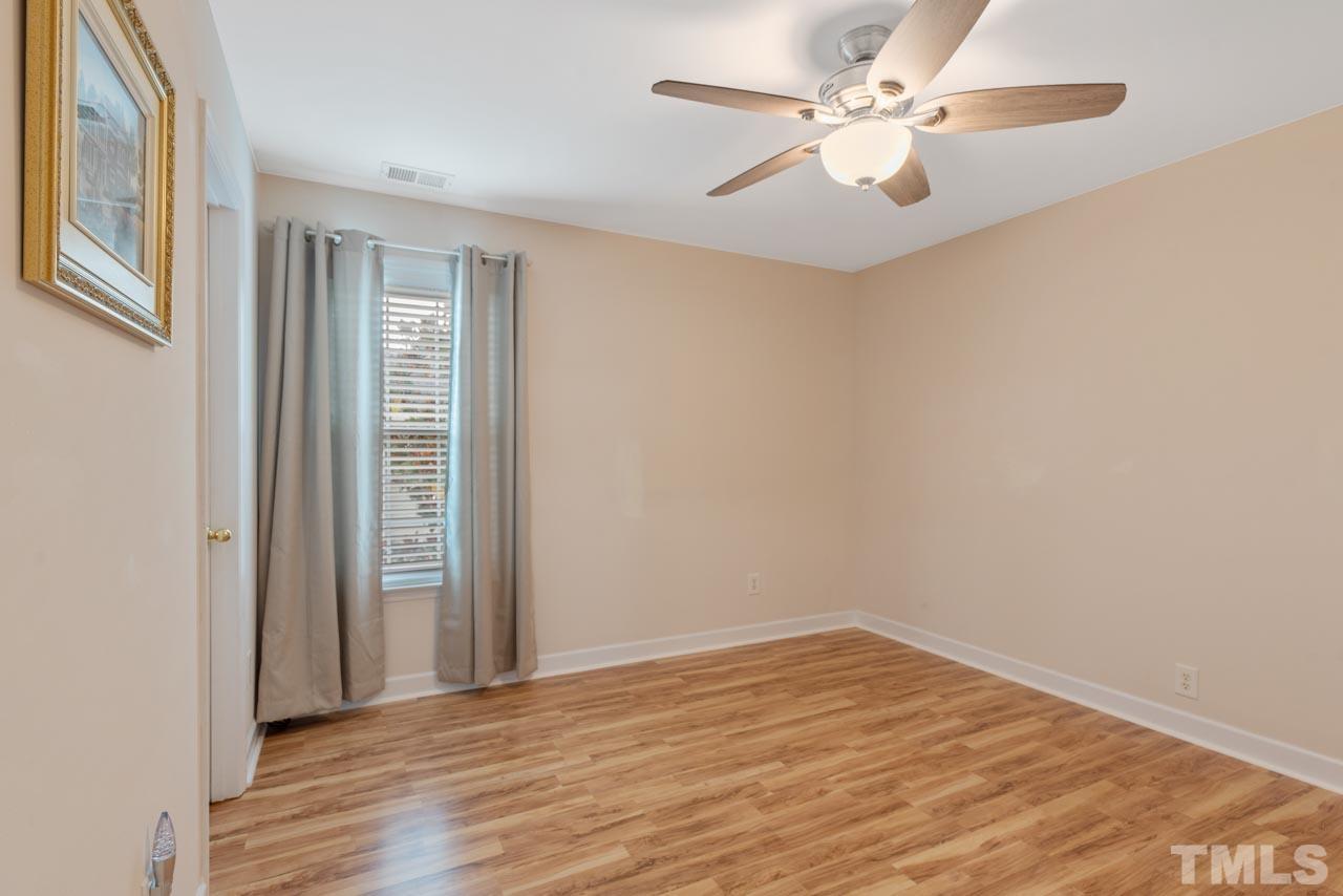 468 Seastone Street Raleigh, NC 27603 - Photo 20 of 28 wooden floor in an empty room with a window