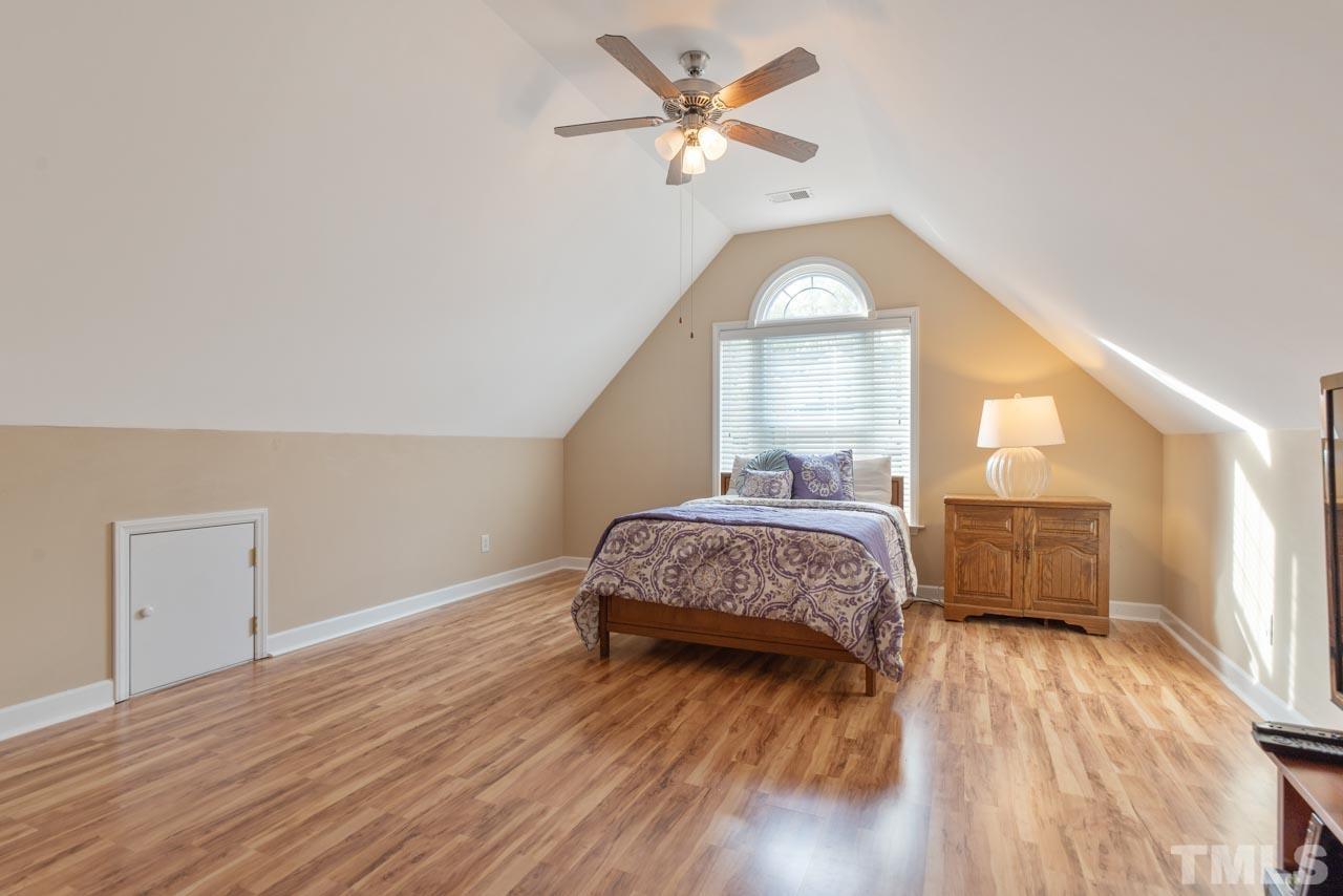 468 Seastone Street Raleigh, NC 27603 - Photo 26 of 28 a bedroom with a bed and a window